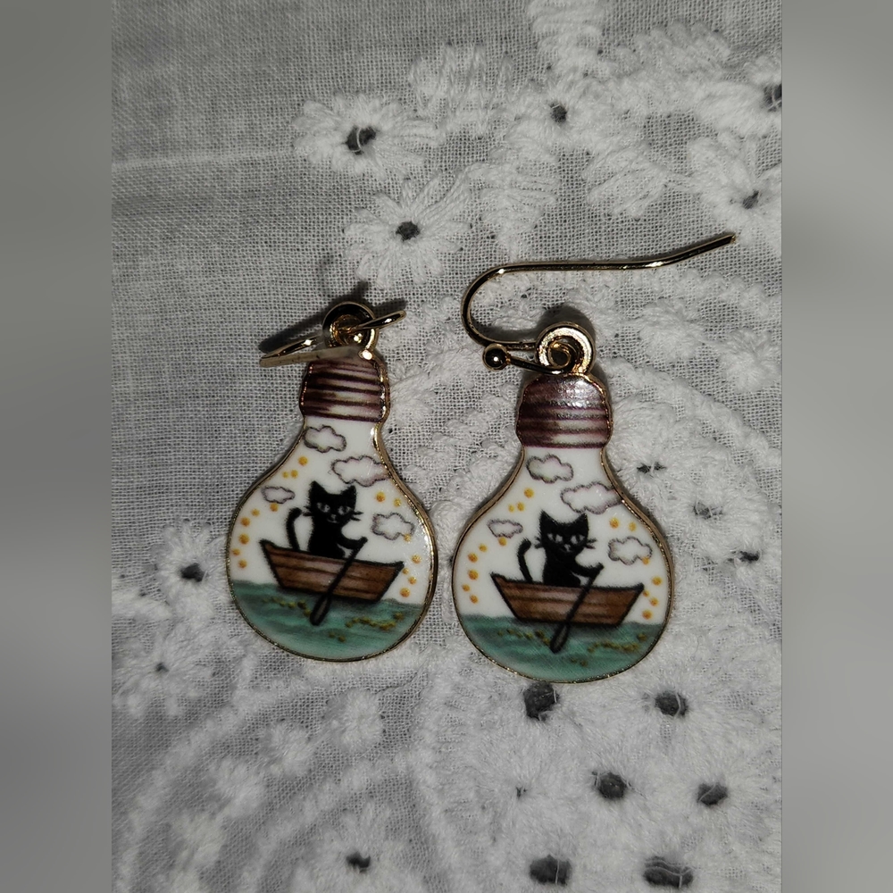 A set of rowboat kitty earrings hand crafted